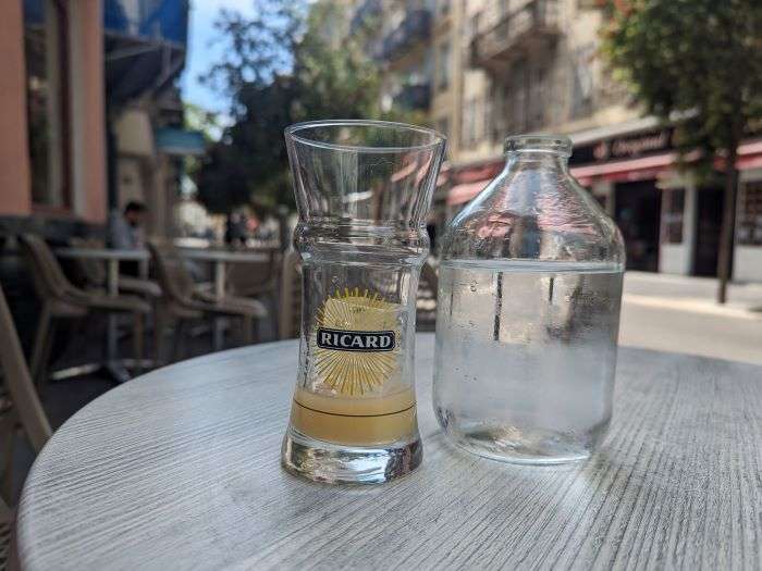 Ricard in a glass with bottle of water